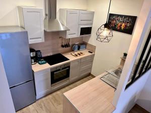 Kuchyňa alebo kuchynka v ubytovaní Appartement à 15min de paris