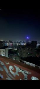 a view of a city at night with lights at شارع مراد على النيل in Cairo