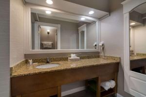 a bathroom with a sink and a mirror at Comfort Inn & Suites Plattsburgh - Morrisonville in Plattsburgh