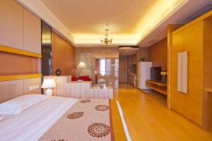 Llit o llits en una habitació de Beijing Xinxiang Yayuan Apartment (Sanlitun)