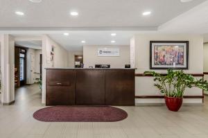 a lobby with a reception desk in a hospital at Clarion Pointe Staunton East in Staunton