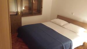 Postel nebo postele na pokoji v ubytování Apartment Gevera