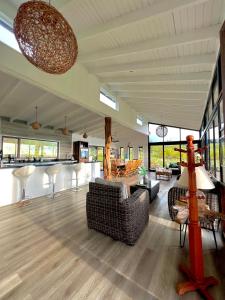 a large living room with couches and a table at Hare Mahatu in Hanga Roa +15 photos