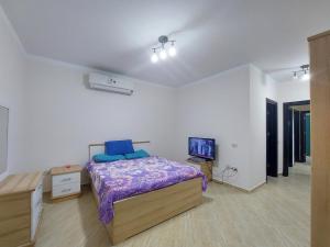 Postel nebo postele na pokoji v ubytování Chalet Rosana Resort الساحل الشمالى