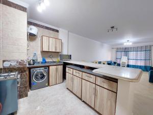 Kuchyň nebo kuchyňský kout v ubytování Chalet Rosana Resort الساحل الشمالى