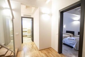 Postel nebo postele na pokoji v ubytování Hotel Arezzo ASC