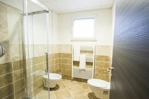 Koupelna v ubytování Hotel Arezzo ASC