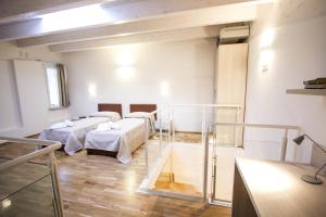 Postel nebo postele na pokoji v ubytování Hotel Arezzo ASC