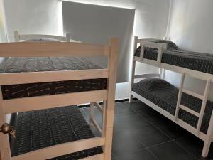 two sets of bunk beds in a room at Apart del Este 5 in Paysandú +11 photos