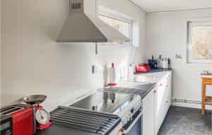 a kitchen with a sink and a stove at Beautiful Home In Asarum With Kitchen in Asarum