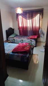 Ένα ή περισσότερα κρεβάτια σε δωμάτιο στο Al Mandarah Bahri, Montaza , Alexandria