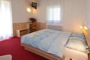 Postel nebo postele na pokoji v ubytování Hotel Zanon