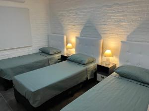 Posteľ alebo postele v izbe v ubytovaní Apart del Este Loft 7