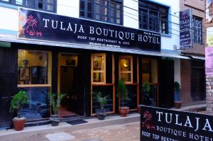 a building with a sign for a turka boutique hotel at Tulaja Boutique Hotel in Bhaktapur