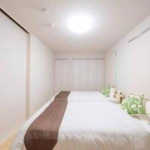 Postel nebo postele na pokoji v ubytování Beachside base KURUWA + 37 fotografií