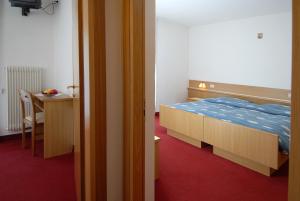 Postel nebo postele na pokoji v ubytování Hotel Zanon