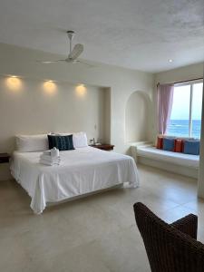 Giường trong phòng chung tại Hotel Estrella de Mar