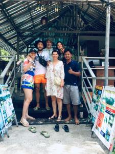 a group of people posing for a picture at Sea View Bungalow in Phi Phi Islands