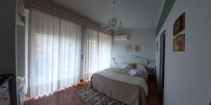 Postel nebo postele na pokoji v ubytování B&B Greco Home