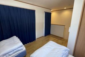 Säng eller sängar i ett rum på 富士山下Cottage-B