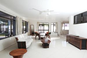 a living room with a couch and a table at Gardenia Apartment-04 in Nadi