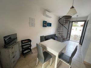 A television and/or entertainment centre at Casa Vacanza SUN & RELAX