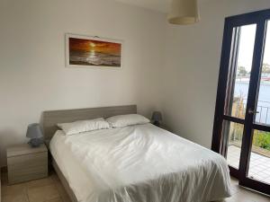 A bed or beds in a room at Casa Vacanza SUN & RELAX