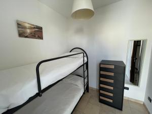 A bed or beds in a room at Casa Vacanza SUN & RELAX