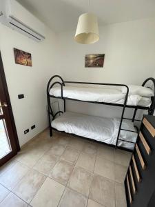 A bed or beds in a room at Casa Vacanza SUN & RELAX