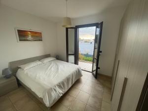 A bed or beds in a room at Casa Vacanza SUN & RELAX