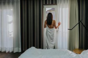 Postel nebo postele na pokoji v ubytování Guesthouse Suiteseven