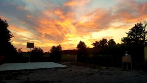 a sunset over a skateboard ramp in a yard at Punta dei Lecci in Riparbella