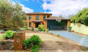 a brick house with a garage and a basketball hoop at Near Airport and Easy to Melbourne CBD by GoodLive in Sydenham