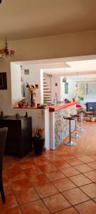 a kitchen with a counter and a table in a room at Coeur de ville maison piscine in Saint-Raphaël