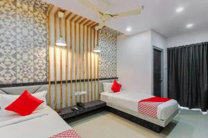 Krevet ili kreveti u jedinici u objektu Hotel Hoysala Inn