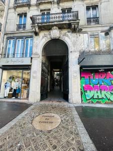 an entrance to a building with graffiti on it at 160 - Urban Fashion Week Paris Vuitton in Paris