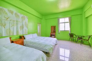 Llit o llits en una habitació de Chunfa B&B