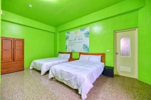 Llit o llits en una habitació de Chunfa B&B