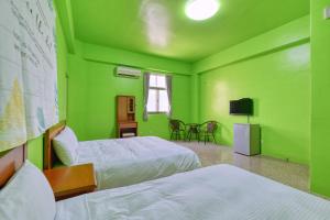Llit o llits en una habitació de Chunfa B&B