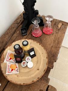 a wooden table with food on top of it at Nobile Dimora di Puglia in Ostuni