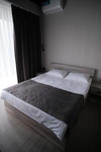 Postel nebo postele na pokoji v ubytování Vip Avtim hotel