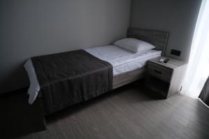 Postel nebo postele na pokoji v ubytování Vip Avtim hotel