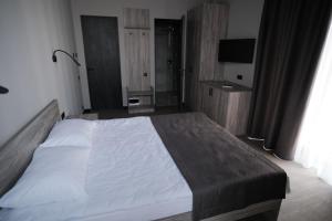 Postel nebo postele na pokoji v ubytování Vip Avtim hotel