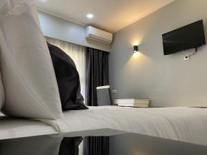 TETE PALM HOTEL客房内的一张或多张床位