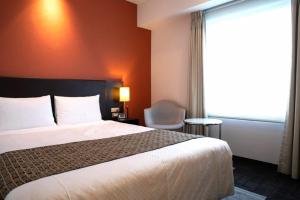 Postel nebo postele na pokoji v ubytování Hotel Bestland + 32 fotografií