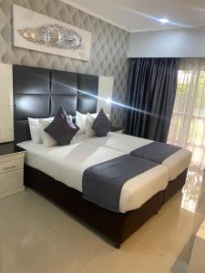 TETE PALM HOTEL客房内的一张或多张床位