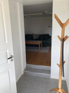 a view of a living room from the hallway at Fin lägenhet på Bjäre med nära till natur och nöje in Båstad