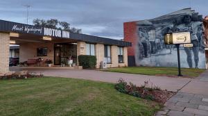 a building with a mural on the side of it at Mount Wycheproof Motor Inn in Wycheproof