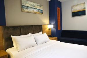 מיטה או מיטות בחדר ב-Nicecy NganHa Hotel