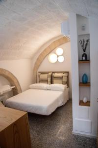 a bedroom with two beds in a room at ENJOY BOUTIQUE ROOMS in Monopoli